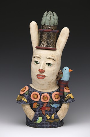 ceramic sculpture Sara Swink bird flowers crown leaves wings rabbit huipil
