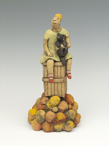 girl with cat sitting on fruit crate ceramic sculpture by sara swink