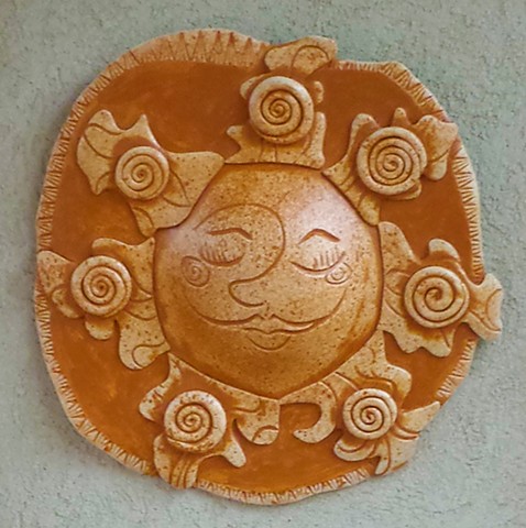 Wall art; hanging sun sculpture; garden art by kellyharrispottery.com