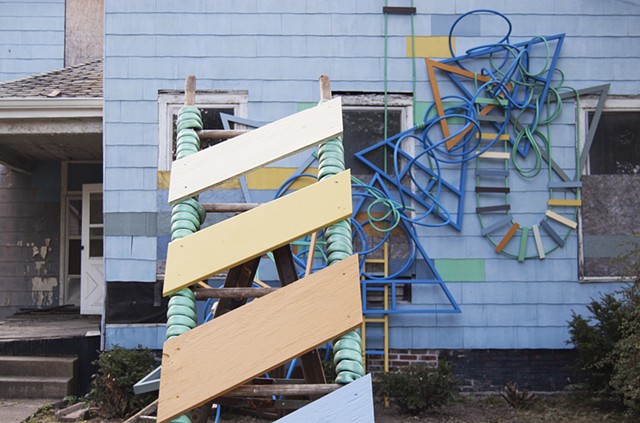 artwork installation sculpture colorful progression tubing reclaimed ladders