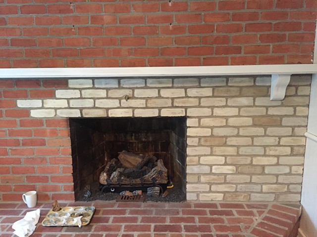 Painted brick fireplace in progress 