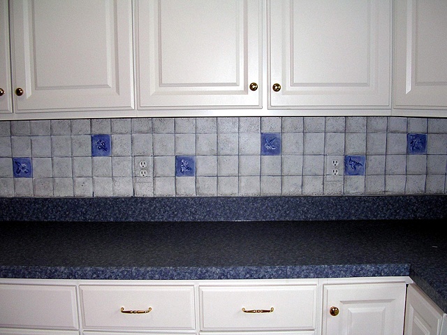 Blue and white tile backsplash