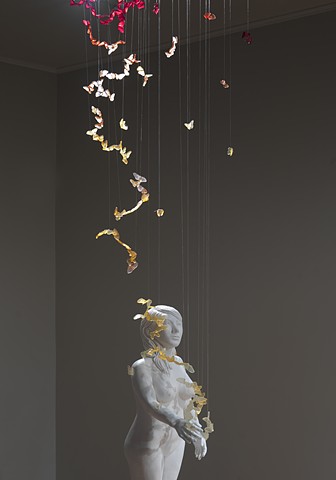 installation with ceramic and mixed media figure with resin butterflies by leigh craven