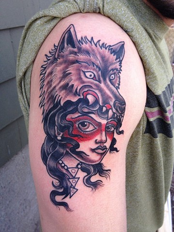 wolf head woman tattoo