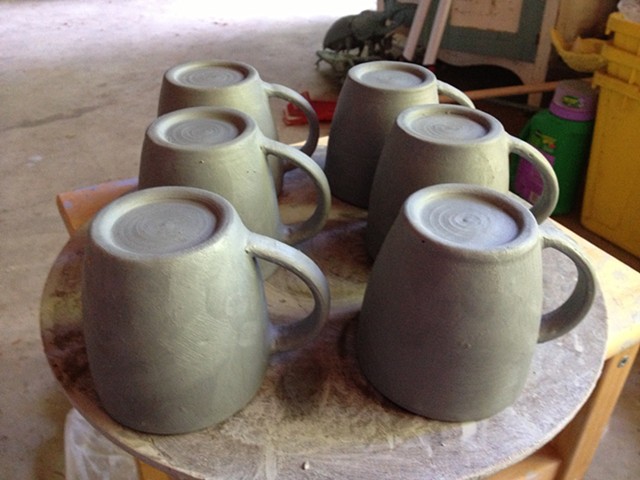Attaching handles to mugs