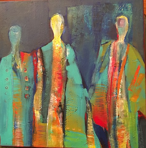 Three cloaked figures