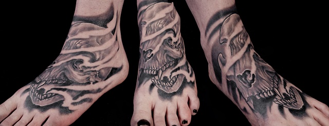 large cat skull black and grey foot tattoo