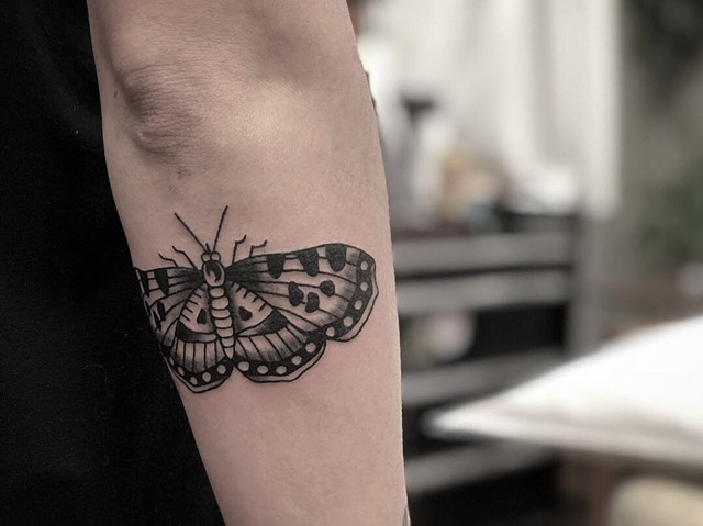 Black moth tattoo by Kc Carew in Bend, Oregon