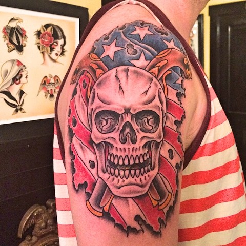 Skull and American flag tattoo by Dirk Spece at Gold Standard Tattoo in Bend, OR.