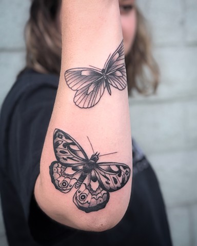 Butterfly arm tattoos by Kc Carew in Bend, Oregon