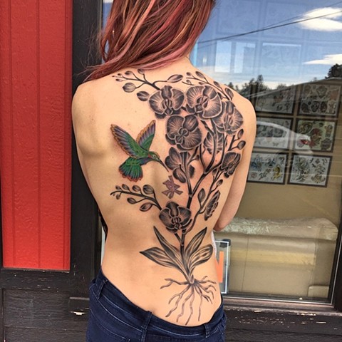 Humming bird and flowers tattoo by Dirk Spece at Gold Standard Tattoo in Bend, OR.