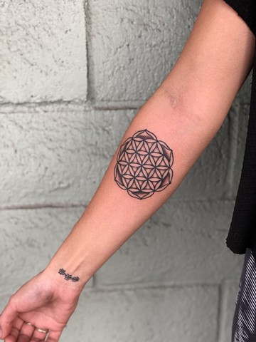 Black mandala tattoo by Kc Carew at Gold Standard Tattoo in Bend, Oregon