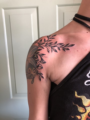 Shoulder flower & leaf tattoo by Kc Carew at Gold Standard Tattoo in Bend, Oregon