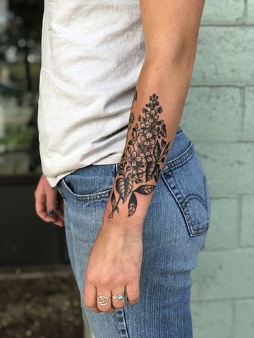 Black ink flower tattoo by Kc Carew in Bend, Oregon