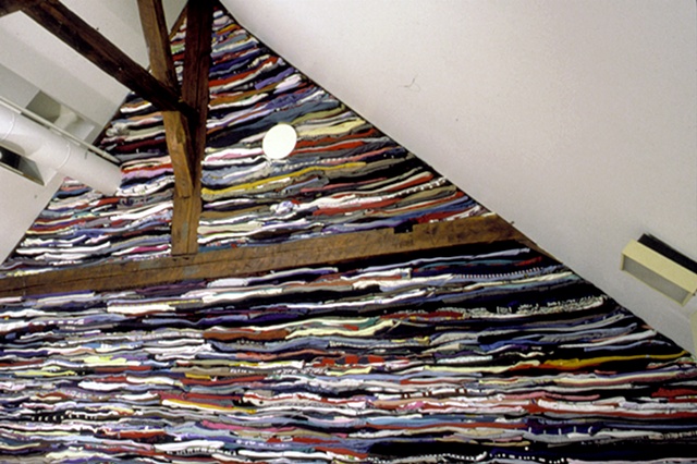 Art installation wall in textile museum made of used clothing
