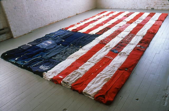 Folded used clothing American flag installation in Salvation Army Thrift Store