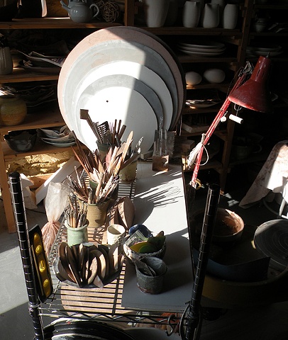 Work table and pottery tools in Carol Naughton Ceramics Studio. Studio is in a 1876 remodeled granary.