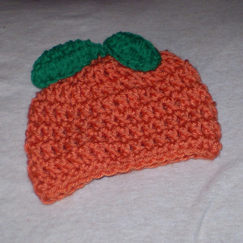 hand-crocheted orange crocheted hat