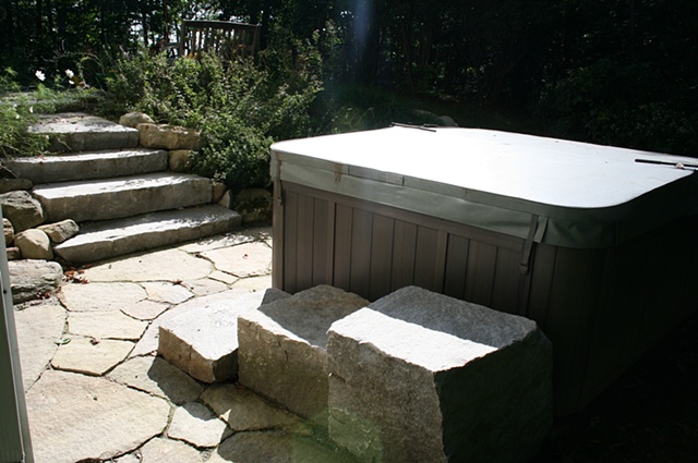granite steps and paving surrounding hot tub