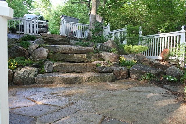 weathered granite steps with boulder walls.
