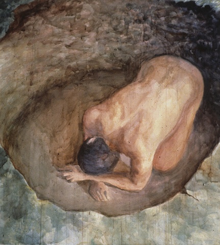 kneeling male figure in a hole seen from above 
