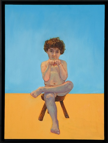 young boy sitting on wooden stool looking at viewer with fists raised facing viewer