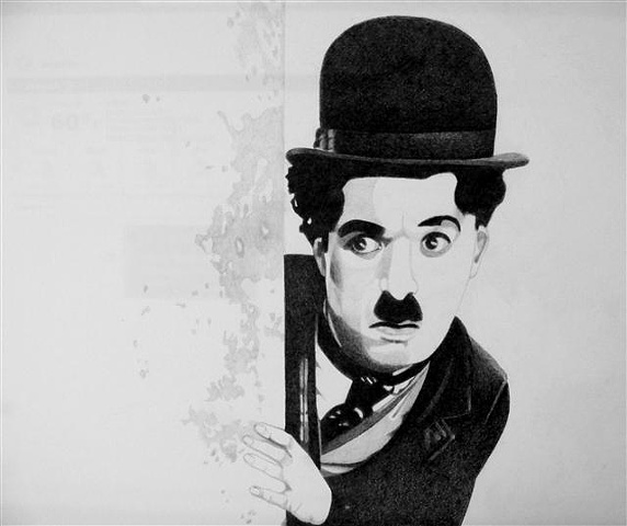 Charlie Chaplin  as The Little Tramp