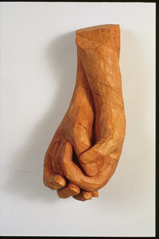 Wood sculpture of hands by Lin Lisberger