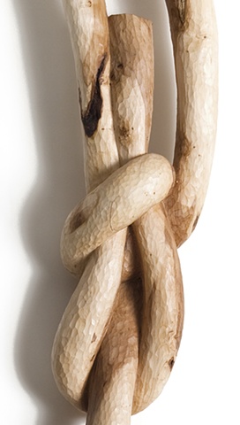 Carved wood sculpture of a knot by Lin Lisberger