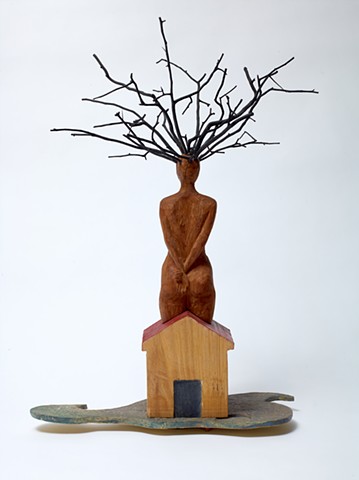 Wood sculpture by Lin Lisberger referencing Jamaica Kincaid short story