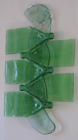 Slumped and fused bottoms, lightly slumped green bottles.