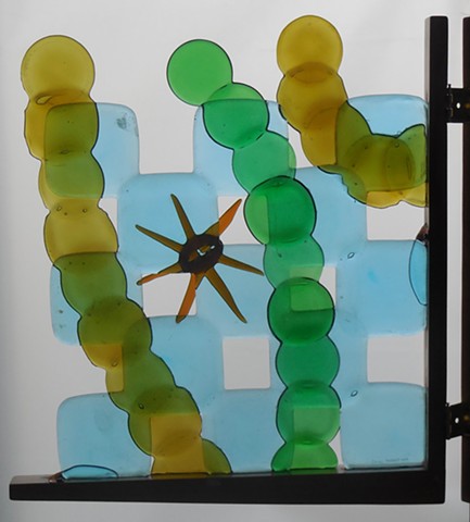A gate.  All the glass except the brown star is bottle bottoms.