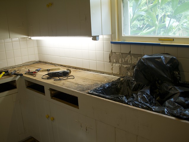 More demo, backsplash has two inches of concrete and metal lath also. Ugh!