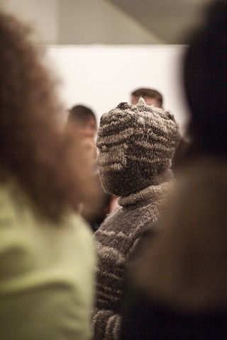 Knitted garment with handspun yarn during performance art of fine thanks by illustrator and artist Bo Yoon