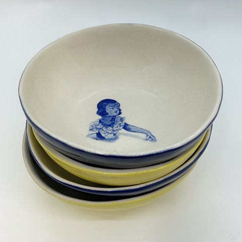 Blue and yellow handbuilt porcelain bowls with painted china doll in cobalt blue.