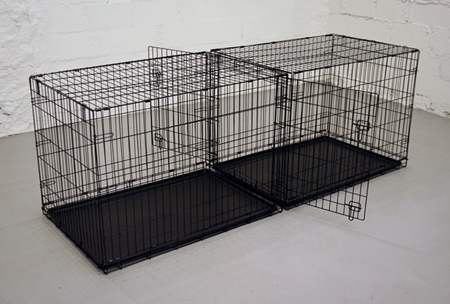 “Two dog cages”