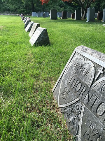 Doug Clouse, The gap in the row is the unmarked grave of well-known graphic designer E. McKnight Kauffer (1890-1954) in Woodlawn Cemetery, the Bronx. 