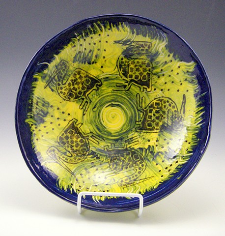 African bird bowl in yellow and blue and black