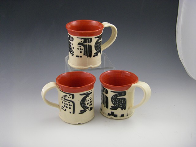 bright and cheery red and black mugs