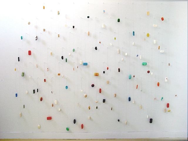 Large sculptural works often based on wall grids - mathematical grids plotted, drawn and then drilled directly into the gallery walls - with a multiplicity of materials and found objects falling into the viewers space to create a three dimensional languag