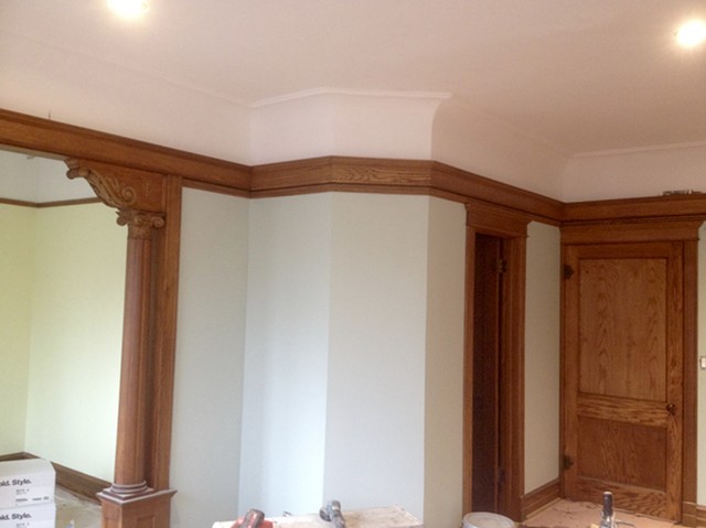Completed re-creation of swan neck plaster cove with matched plaster detail and all refinished  trim installed