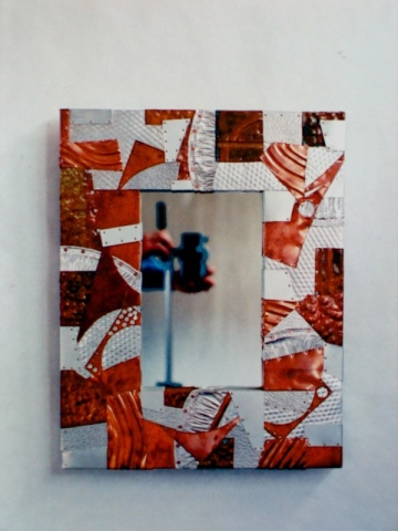 smaller size rectangular mirror made from individually cut recycled metals such as copper aluminum etc. Sold
