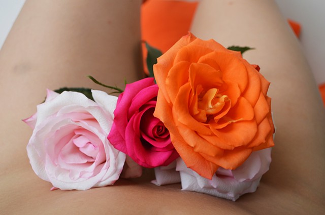 photograph of woman body bouquet roses red pink orange bruise by Robyn LeRoy-Evans