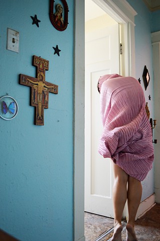 photograph of woman pink drapery cross jesus crucifix hallway interior New Orleans by Robyn LeRoy-Evans