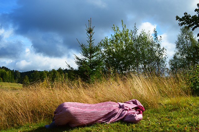 surreal photograph of headless woman pink dress landscape sky Sweden by Robyn LeRoy-Evans