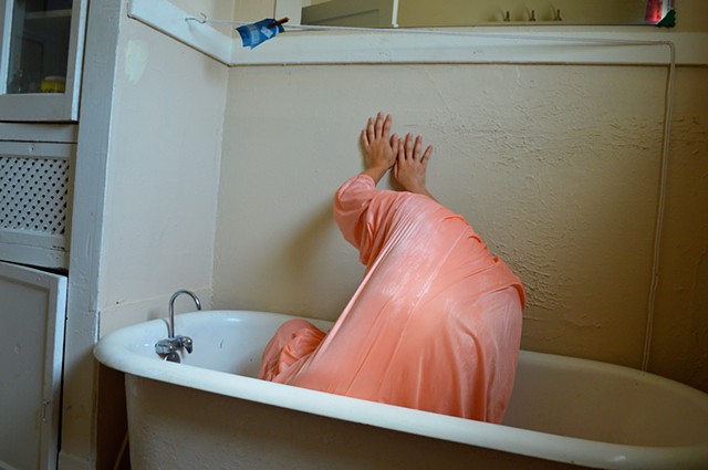 photograph of woman dress bathtub hands drapery interior bathroom by Robyn LeRoy-Evans
