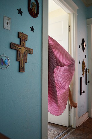 photograph of woman pink drapery cross jesus crucifix hallway interior New Orleans by Robyn LeRoy-Evans