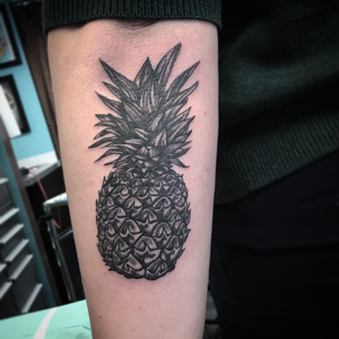 pineapple tattoo at strange world tattoo in calgary 