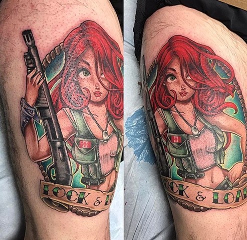 redheaded girl with a gun tattoo on upper thigh Strange World Tattoo Calgary, Alberta Canada