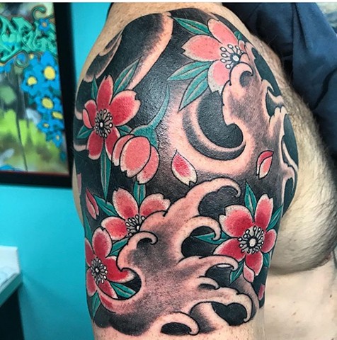 Japanese cherry blossom tattoo with waves strange world tattoo calgary canada tattoo artist's calgary 
